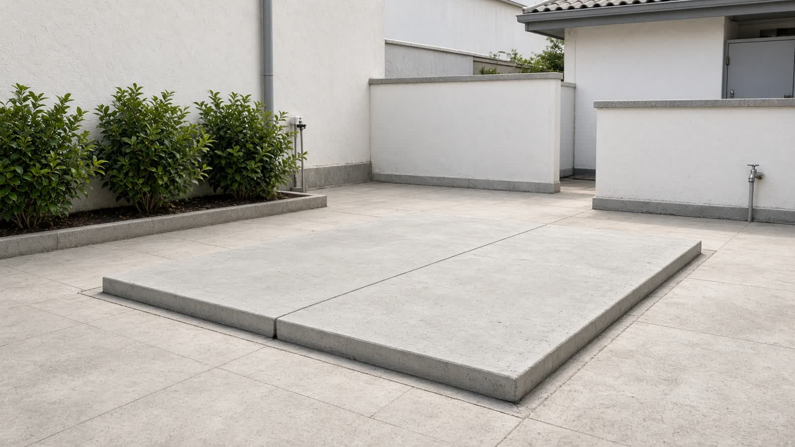 A residential water sump cover in a bright courtyard